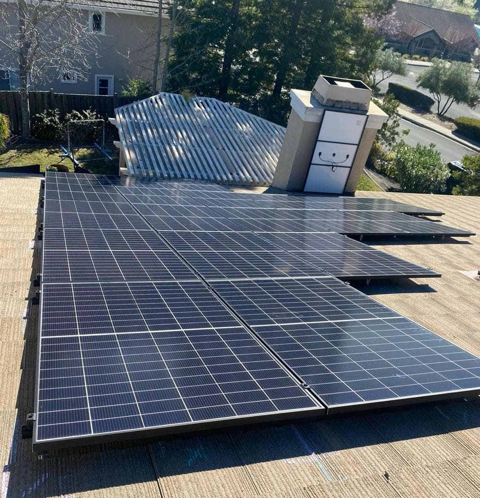 Black solar panels on sloped roof