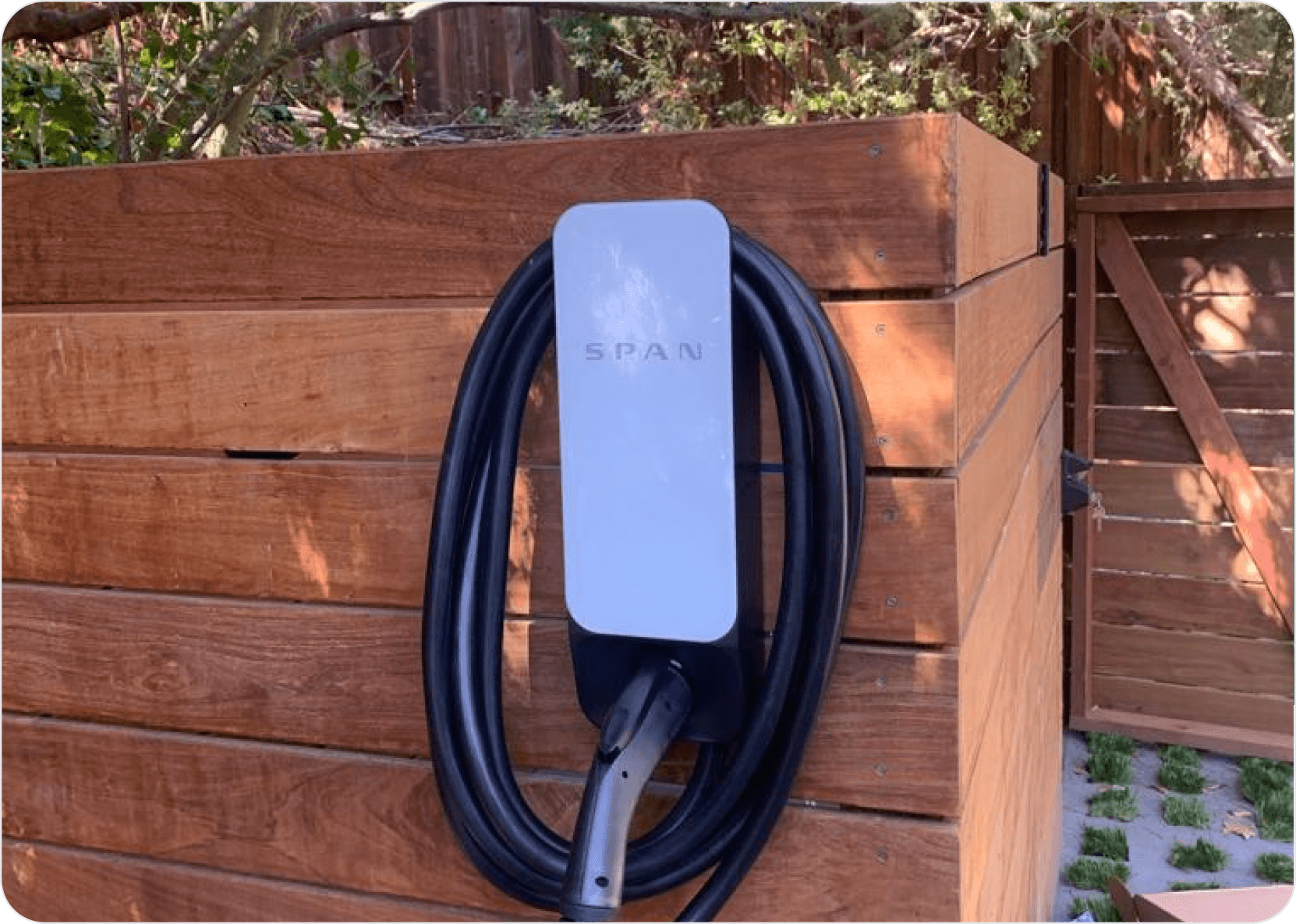SPAN EV charger on wooden wall